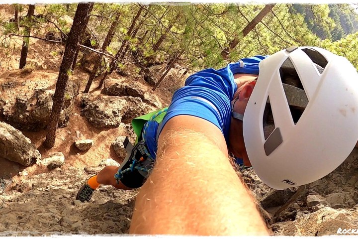 a person climbing a rocky mountain