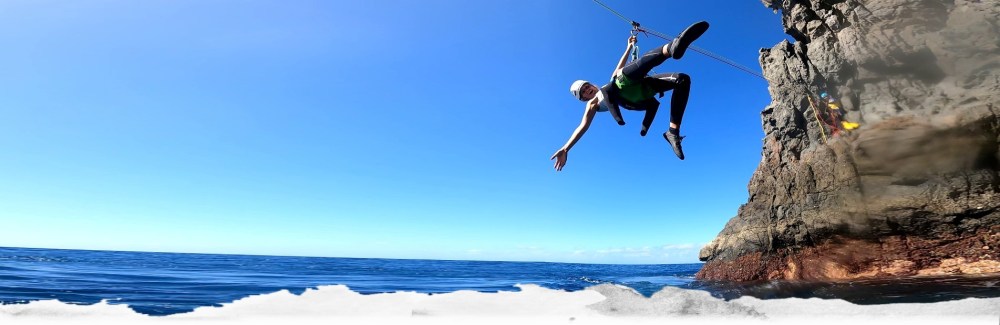 a man flying through the air while riding skis